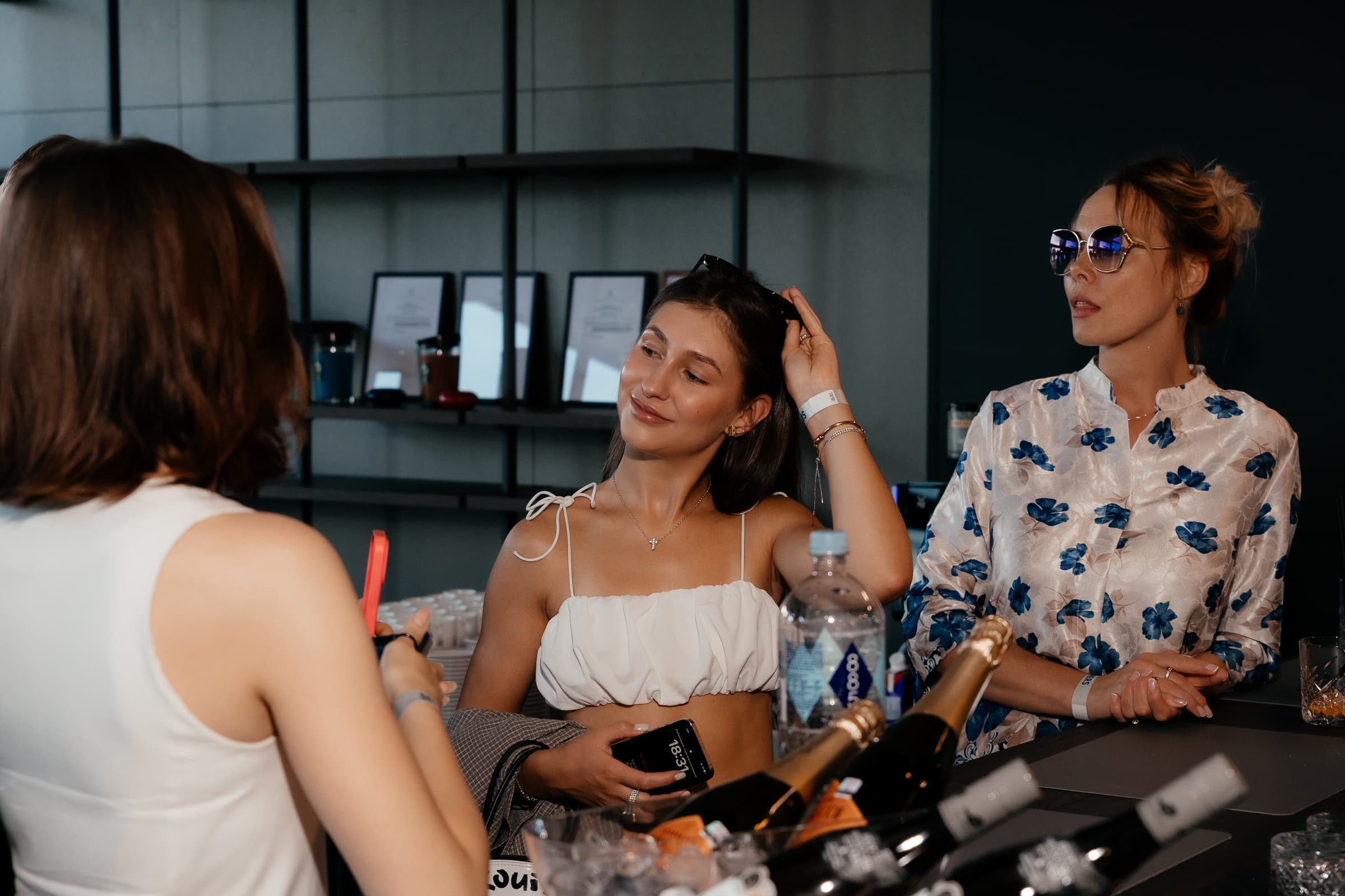 Guests gathered around a table during a private event at SeoVillage