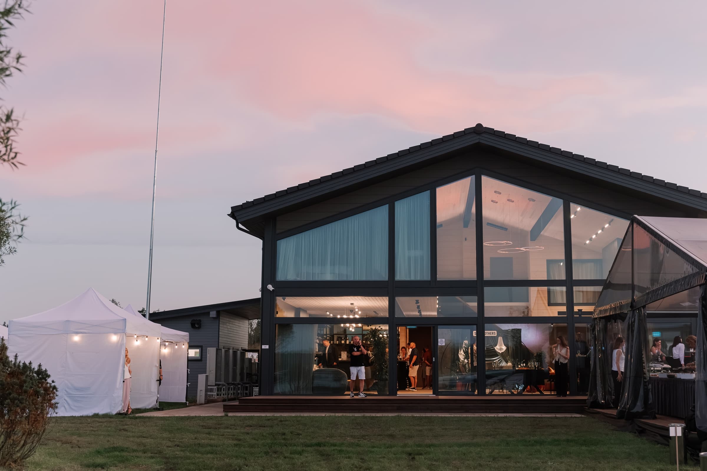 Evening view of SeoVillage event venue with illuminated glass facade